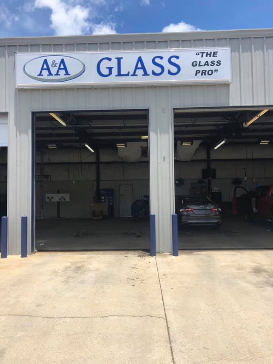 A&A Glass 'The Glass Pro' shop front with open service bays and a car pulled inside