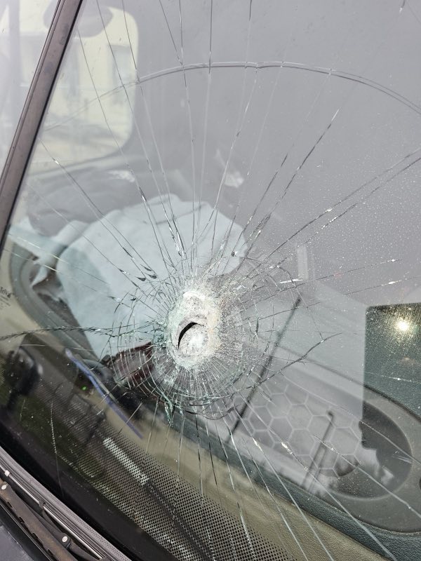 Close-up of a shattered windshield, the kind of damage A&A Glass repairs
