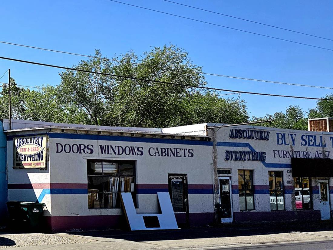 The Absolutely Everything storefront on E. Main St, Farmington, with hand-painted Doors Windows Cabinets and Buy Sell Trade signage