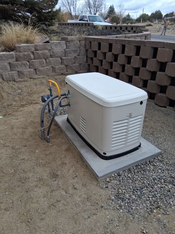 Standby generator installed on a poured pad