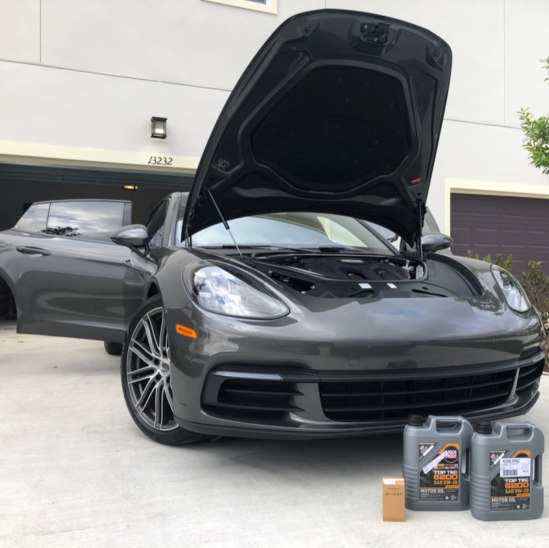 Mobile oil service on a Porsche Panamera at the client's home