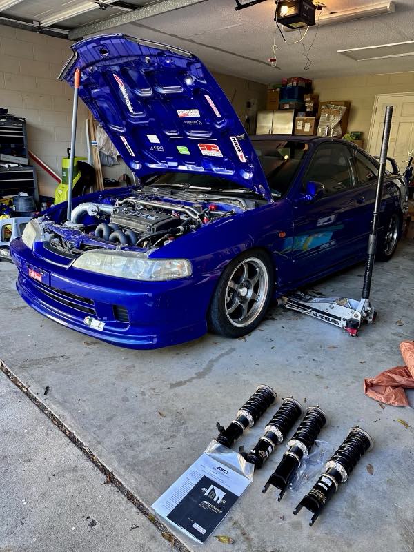 Coilover suspension install on a blue Integra