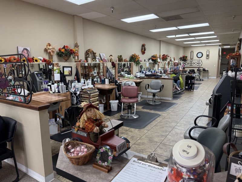 The Bold En' Beautiful salon floor with styling stations and seasonal decor