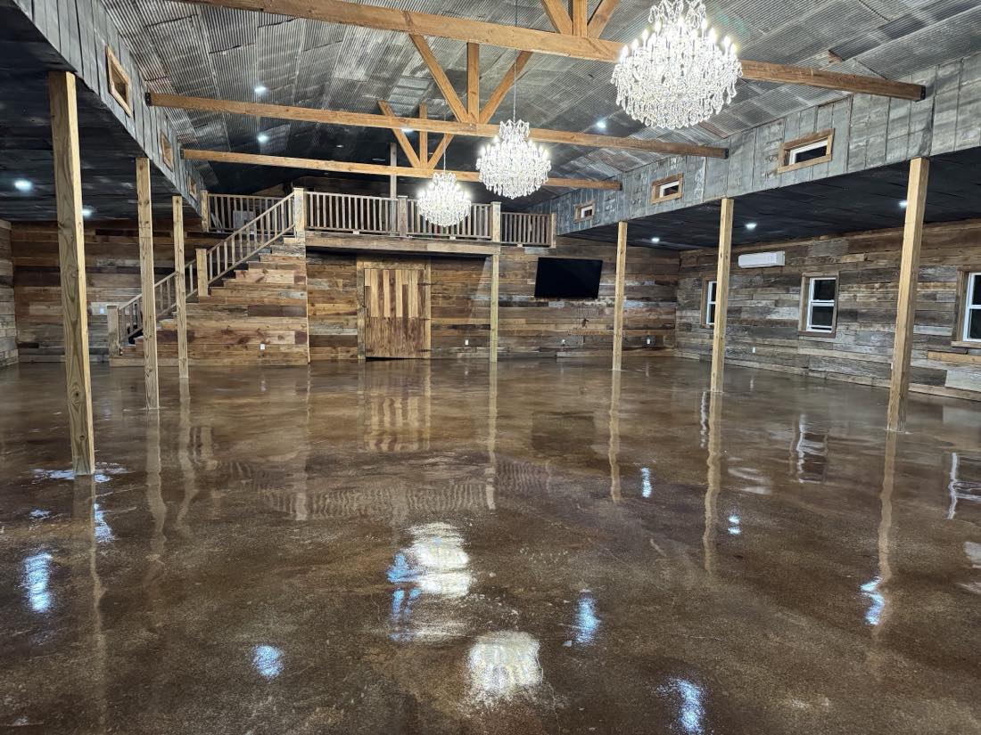 Event venue with a high-gloss polished concrete floor reflecting chandeliers