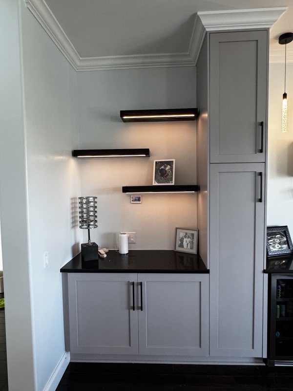 Built-in shelving nook with floating shelves and cabinetry