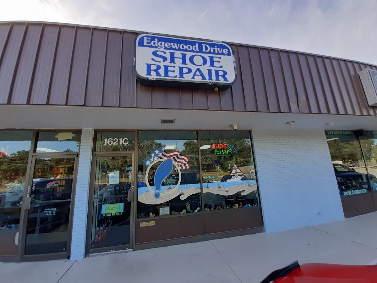 Edgewood Drive Shoe Repair storefront with its blue sign and hand-painted window at 1621C E Edgewood Dr, Lakeland