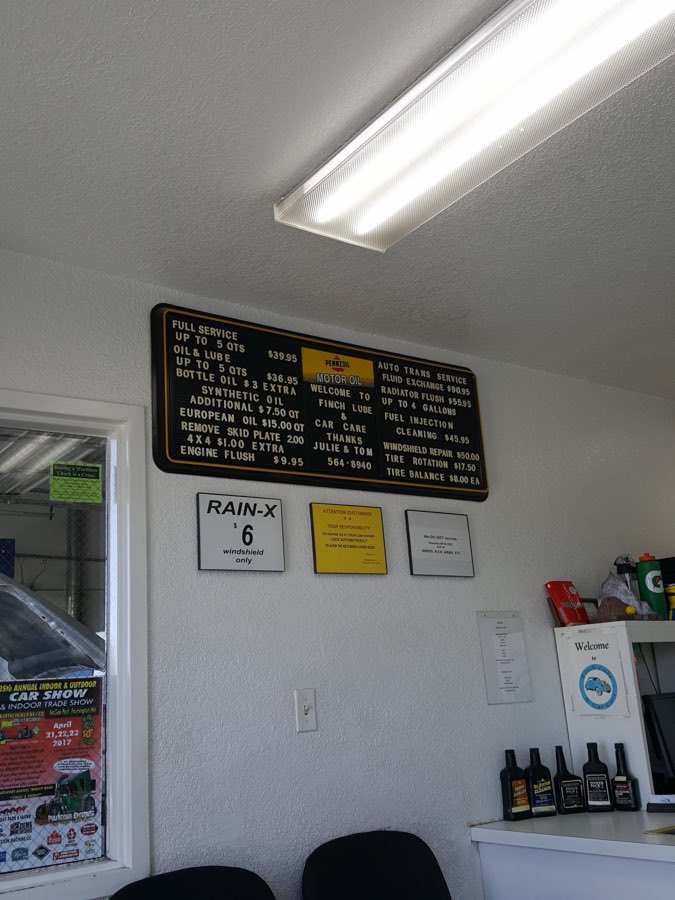Finch Lube & Car Care's clean waiting room and service board welcoming customers.