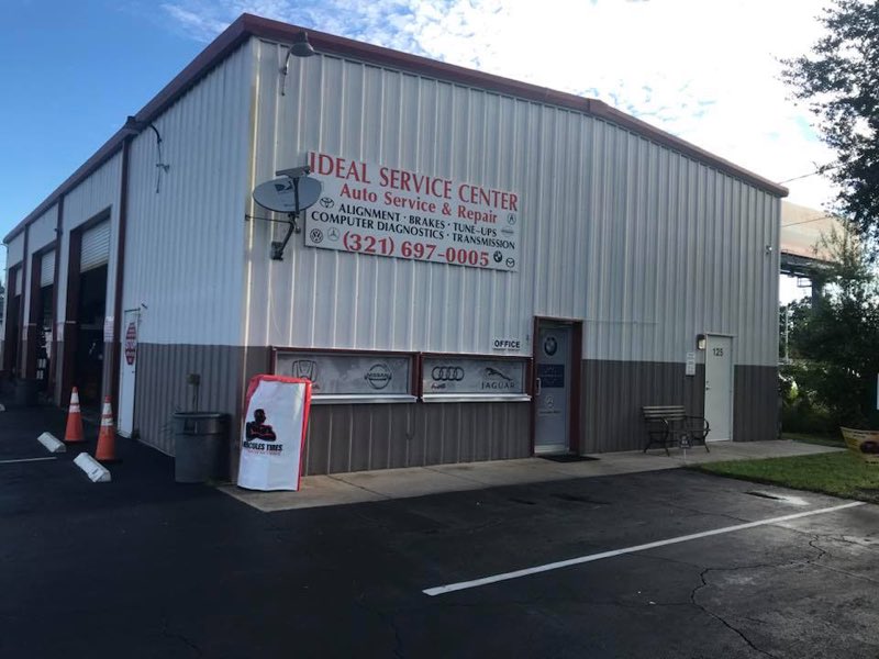 Ideal Service Center building exterior with signage listing alignment, brakes, tune-ups, computer diagnostics and transmission