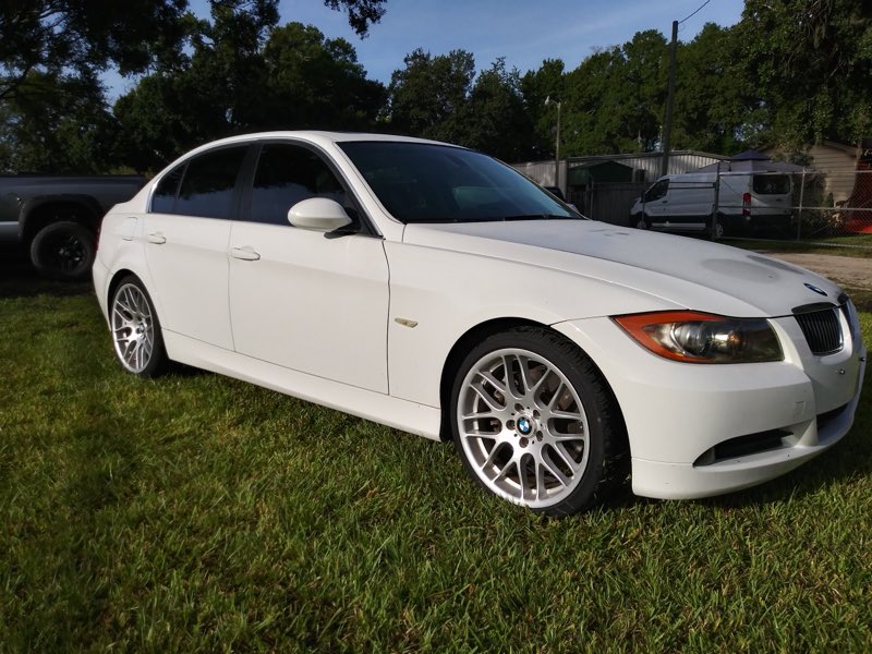 A clean white BMW 3-series after service at John's Auto & Classics