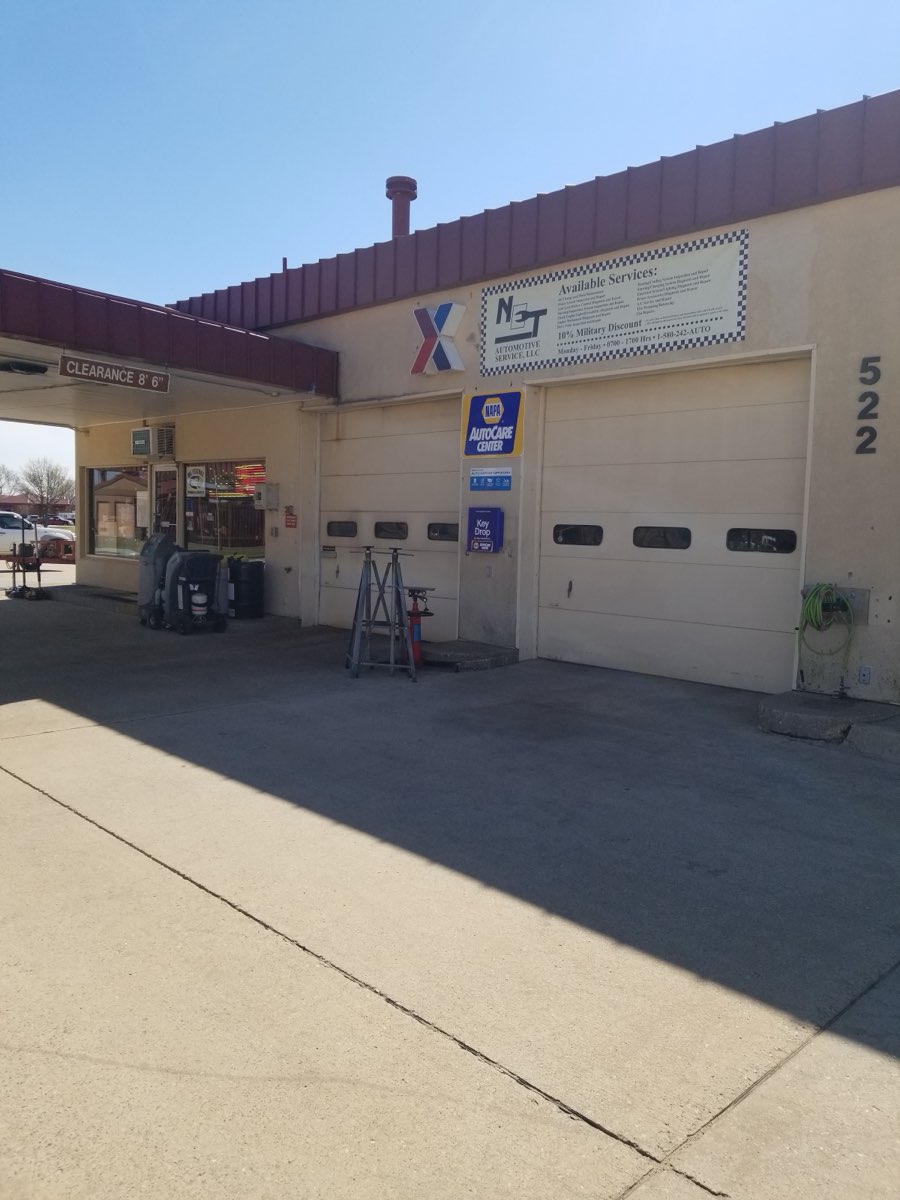 NET Automotive Service shop front on Elam Rd in Enid, with NAPA AutoCare signage and service bays