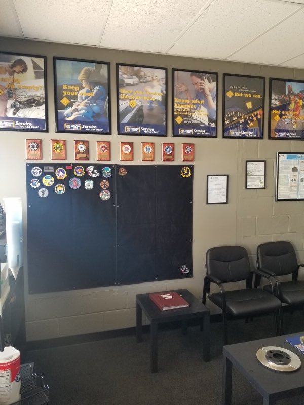 Waiting room with NAPA service posters and military service plaques