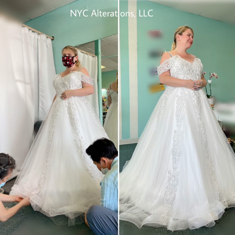 Wedding gown fitting in progress, the tailor pinning the hem at NYC Alterations