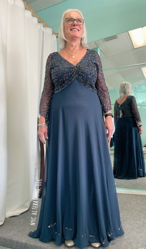 Mother of the bride in a navy beaded gown being fitted in the NYC Alterations shop