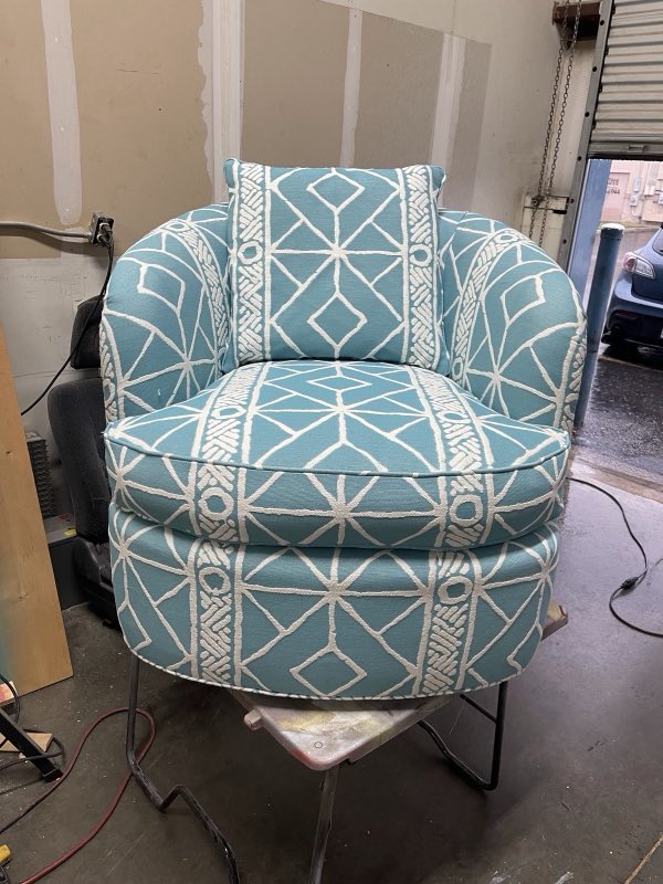 Teal and white geometric-pattern barrel swivel chair reupholstered
