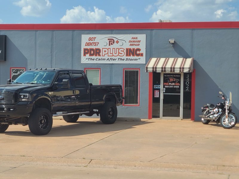 PDR Plus Inc shopfront with a lifted black truck parked out front