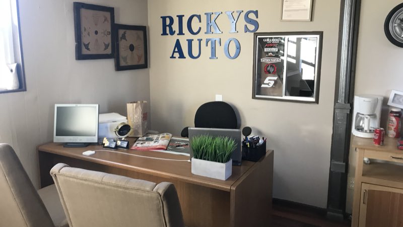 Waiting area with the Ricky's Auto wall sign