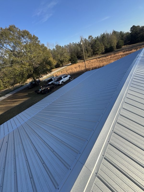 New metal roof panels being installed