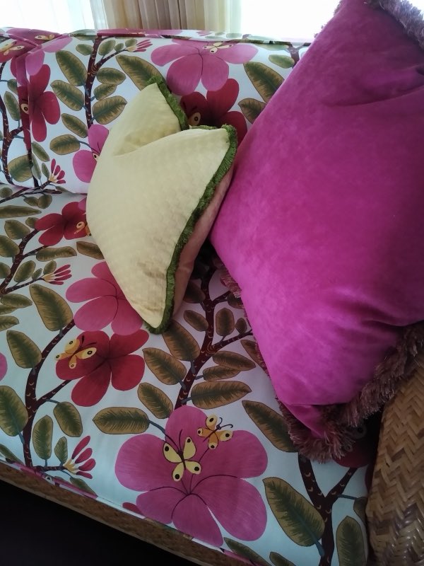 Close-up of the floral fabric and accent pillow